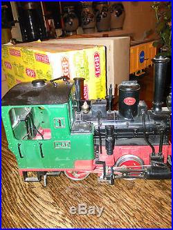Locomotive à vapeur+ 3 wagons+circuit complet de rails+transfo